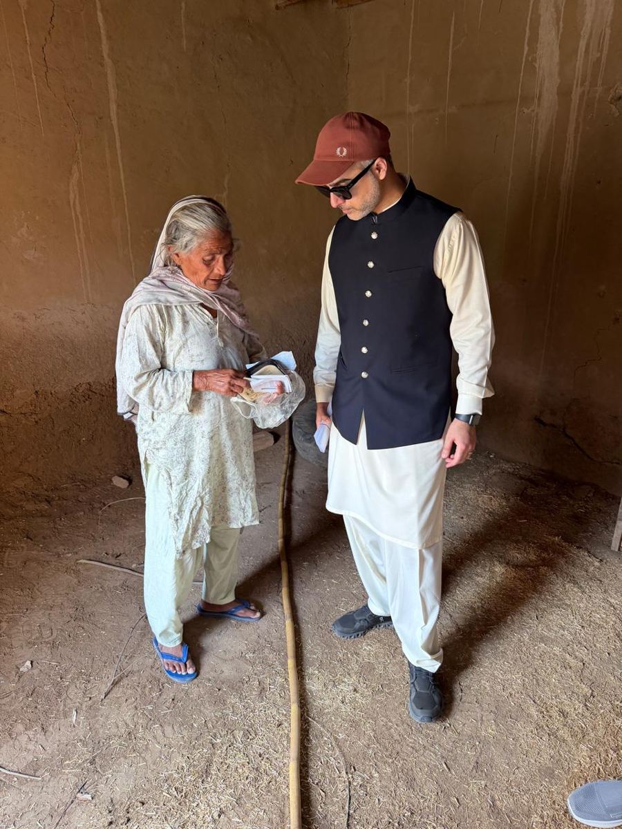 Our field team standing with a supported family