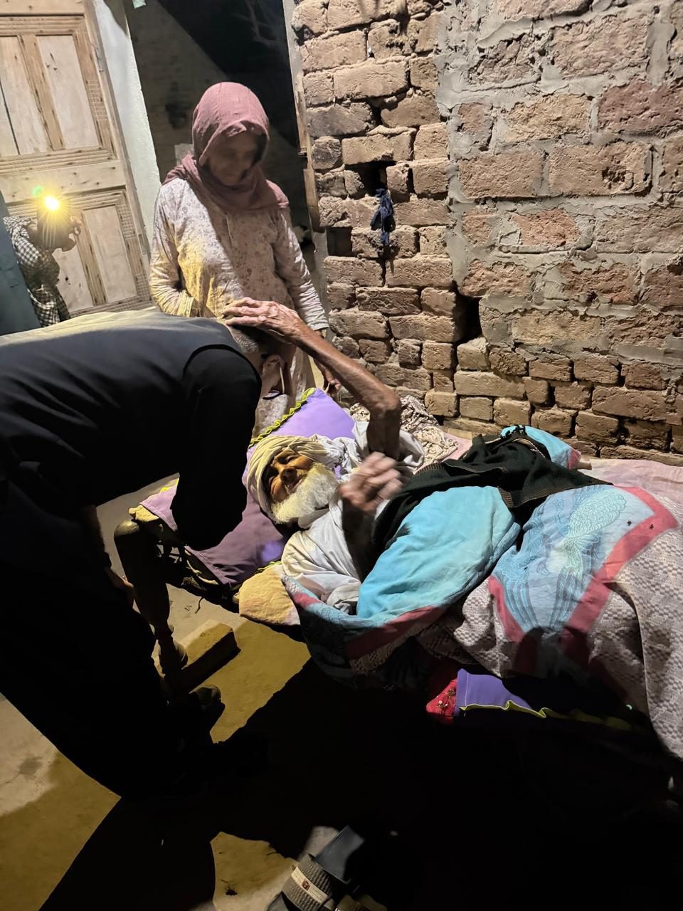 A woman receiving urgent medical support at home